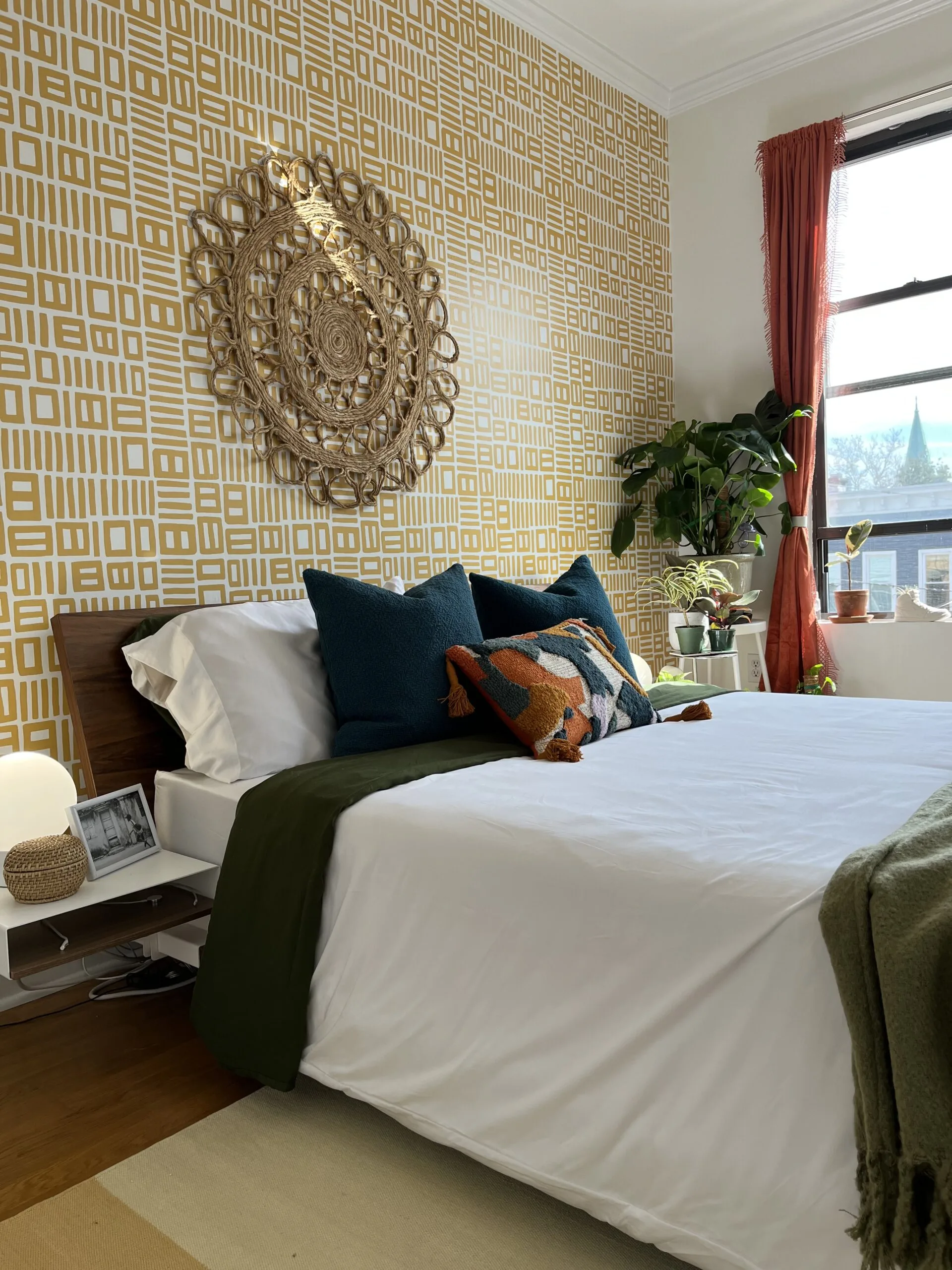 Modern open-concept living area with neutral tones, statement lighting, and contemporary furniture